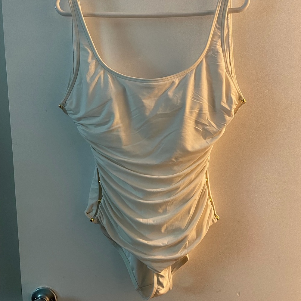 White one piece with gold accents
